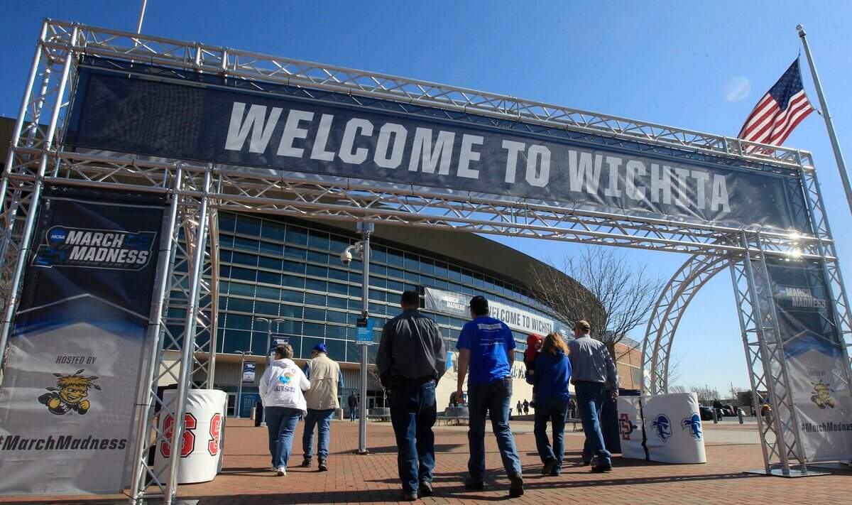 Fans arrive at INTRUST Bank Arena for NCAA men’s basketball tournament games in Wichita. Strong community support helped the city secure opening-round games in 2027 and 2028.