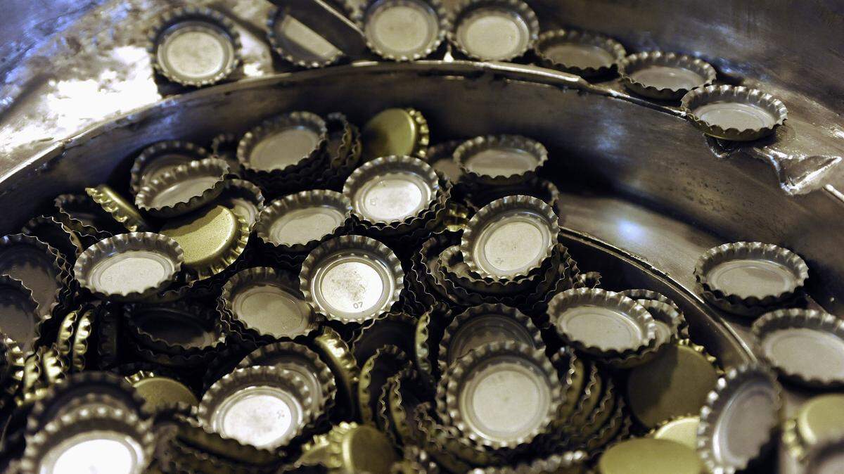 Beer bottle caps are seen in this 2013 file photo by The Associated Press.