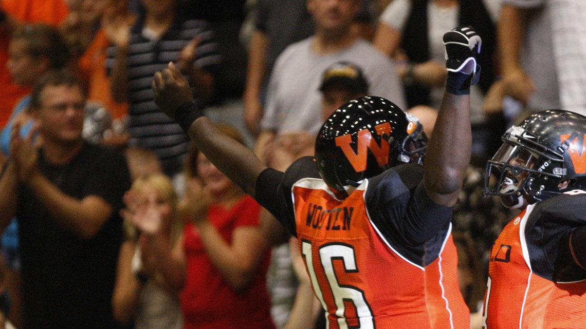 The Wild's Dixie Wooten and Hurtis Chinn celebrate after teaming up for a TD in the first quarter against Rochester in the second round of the Indoor Football League playoffs at Hartman Arena on Friday. (July 2, 2010)