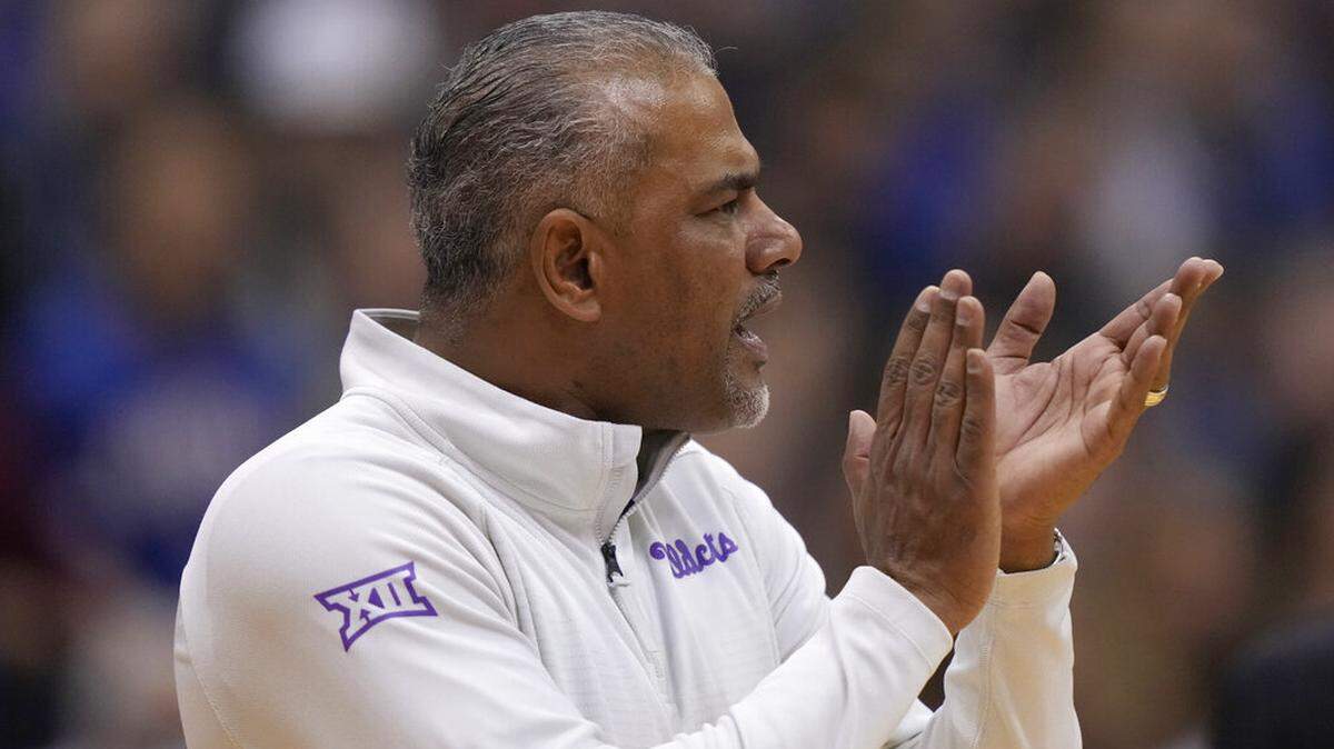 Kansas State head coach Jerome Tang talks to his players during the second half of an NCAA college basketball game against Kansas Tuesday, Jan. 31, 2023, in Lawrence, Kan. Kansas won 90-78. (AP Photo/Charlie Riedel)