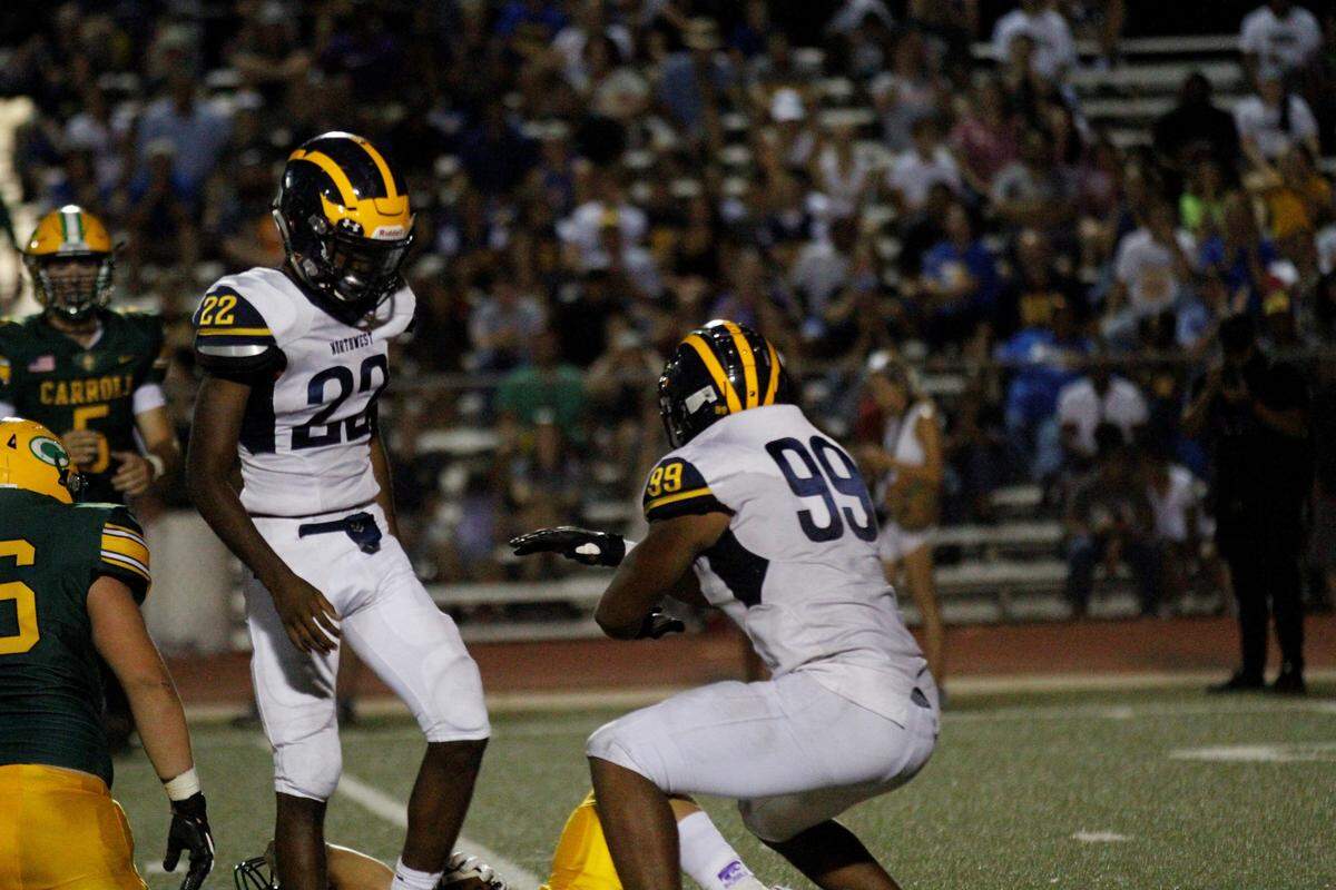 Wichita Northwest senior defensive end Marcus Hicks celebrates a tackle for loss against Bishop Carroll during the Grizzlies 23-22 win over the Golden Eagles on Friday night. (Aug. 31, 2018)