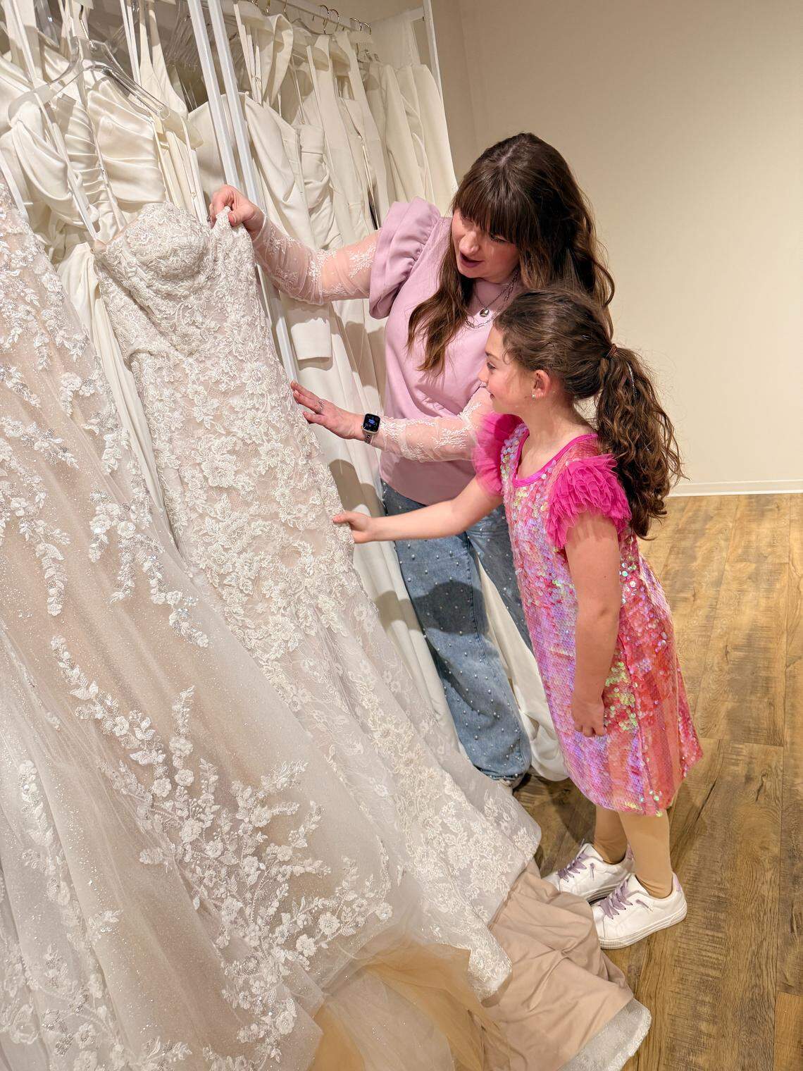 Bella Veil Bridal owner Ericia Stevens is opening a Bradley Fair pop-up version of her Newton store. She’s shown here with her daughter, Savvy, who was born two months after Stevens opened Bella Veil, where Savvy has “basically grown up.”