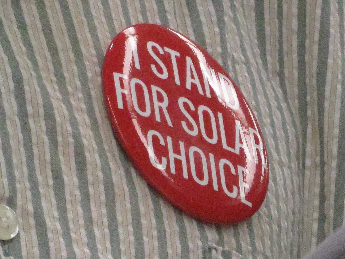 Supporters of solar energy wore buttons like this to a recent public hearing on Westar Energy's rate-hike proposal.