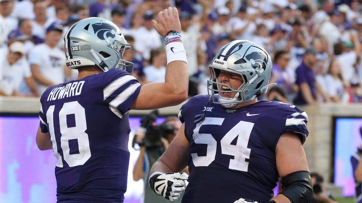 Kansas State Wildcats offensive lineman Hadley Panzer (54) and quarterback Will Howard (18) celebrate a touchdown late in the second quarter against the Southeast Missouri State Redhawks at Bill Snyder Family Football Stadium.