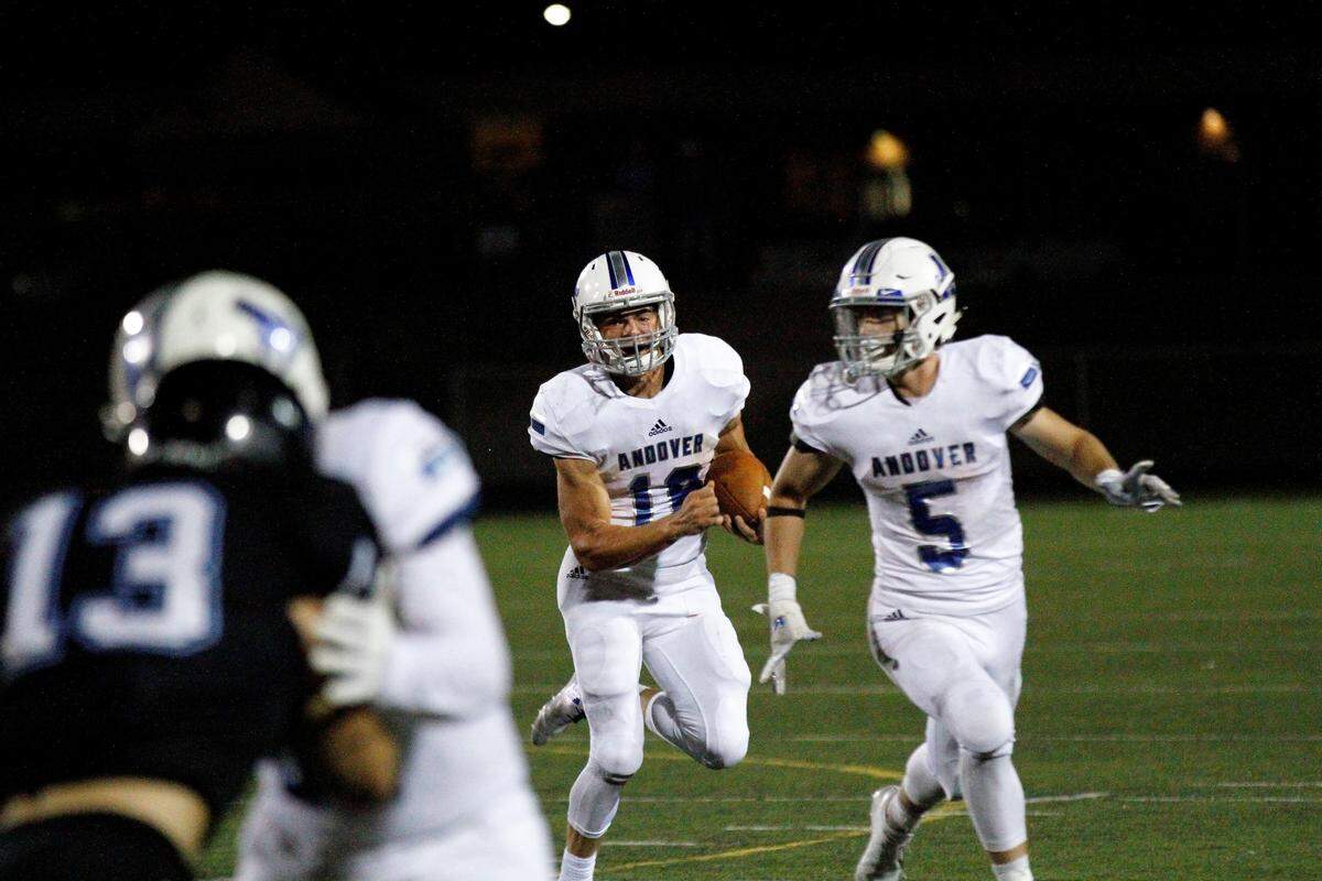 Andover sophomore quarterback Eli Fahnestock ran for this first down in the Trojans’ 30-22 win at Goddard Eisenhower on Thursday night. (Sept. 13, 2018)