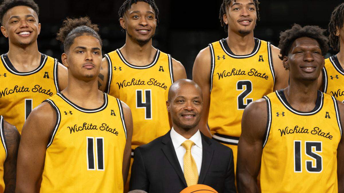 The Wichita State Men’s Basketball team has their photo taken during media day. At center is head coach Isaac Brown.