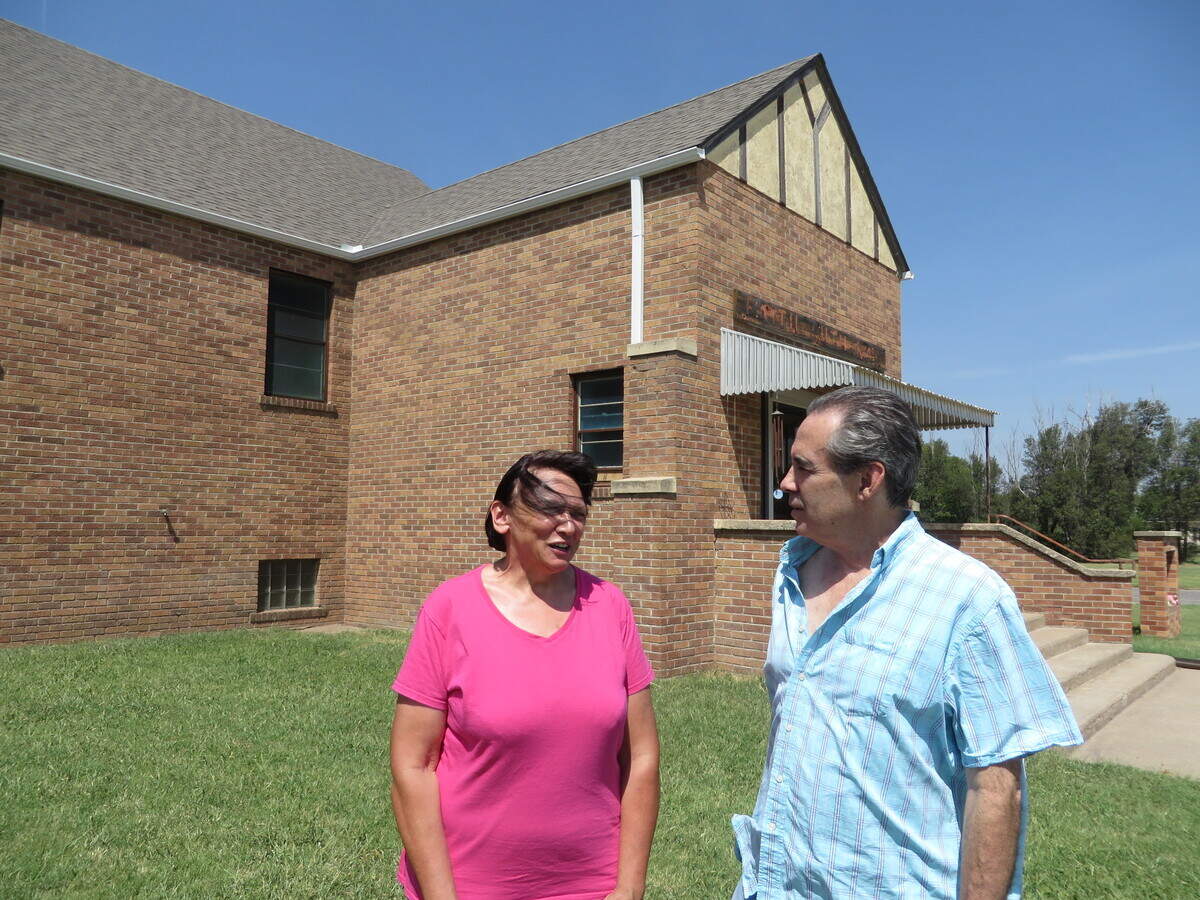 Dorothy Tobe and Mike Rosseau in front of the former church they’ve since remodeled as a home in St. John.