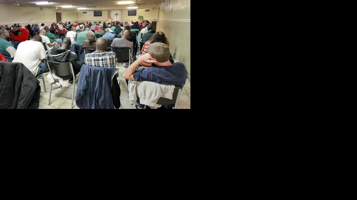 Men listen to the nightly sermon at the Union Rescue Mission. (Nov. 26, 2013)

