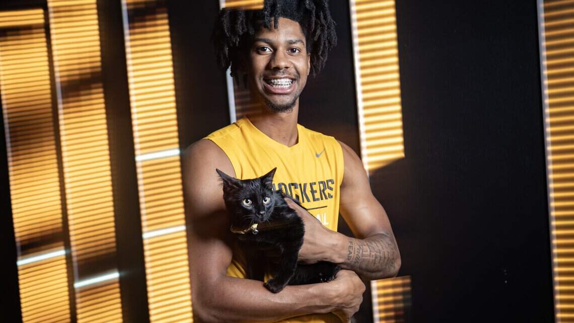 A WSU fan promised a cat if he stayed. Dillon Battie promised something back