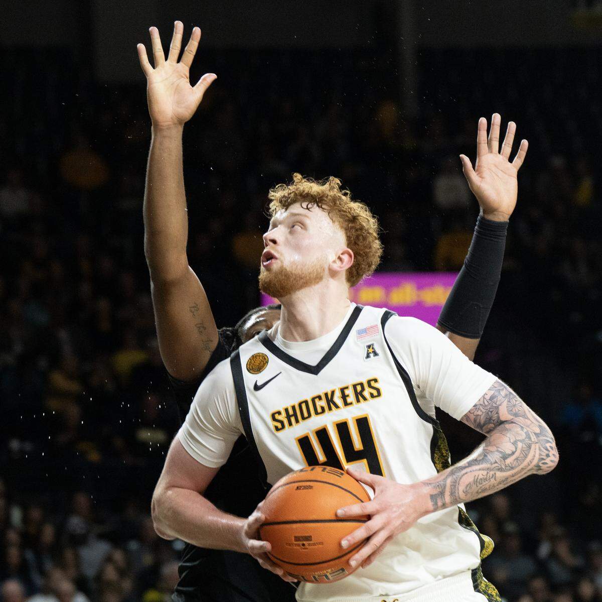 Wichita State’s Will Berg goes up for a shot against Milwaukee in the first half at Koch Arena.
