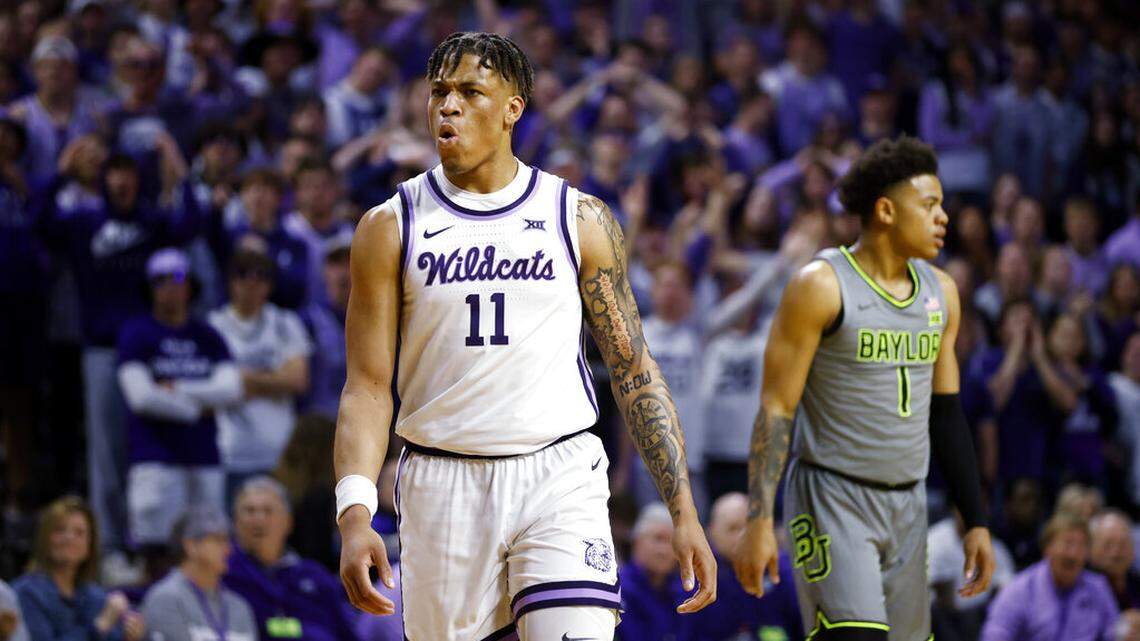 Kansas State forward Keyontae Johnson (center) reacts as a timeout is called as he and Baylor guard Keyonte George walk off the court during the first half on Tuesday, Feb. 21, 2023, in Manhattan, Kan.