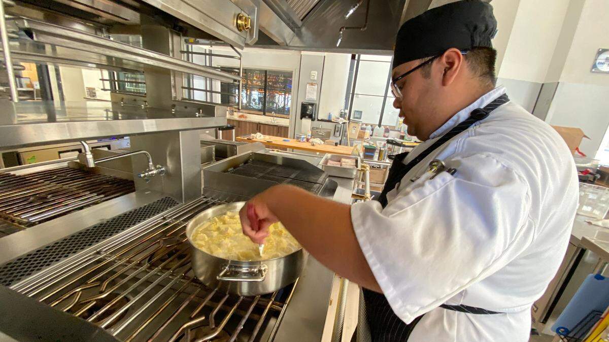 WSU Tech culinary student Giang Vu prepares food in anticipation of The Bistro’s first day of operation.