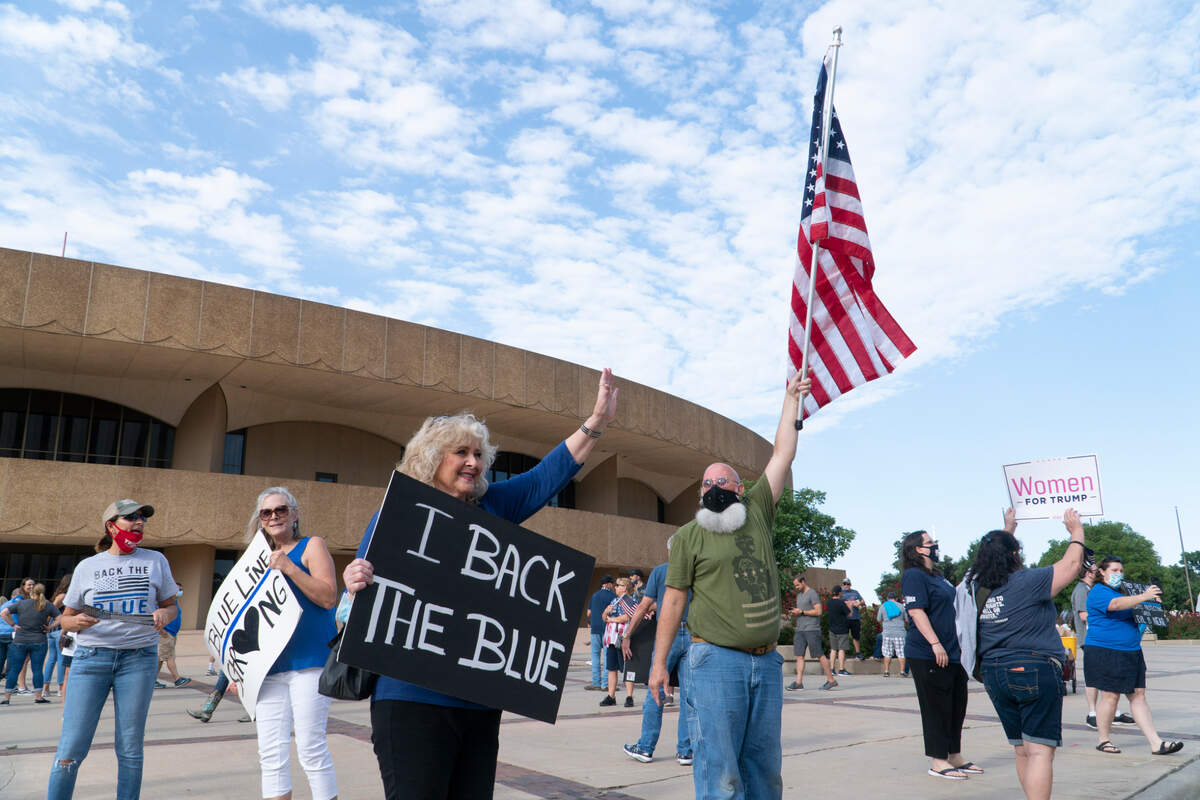 Around 200 people attended the “Back our Blue” rally on Kennedy Plaza in front of Century II to show their support for police officers on August 11, 2020.