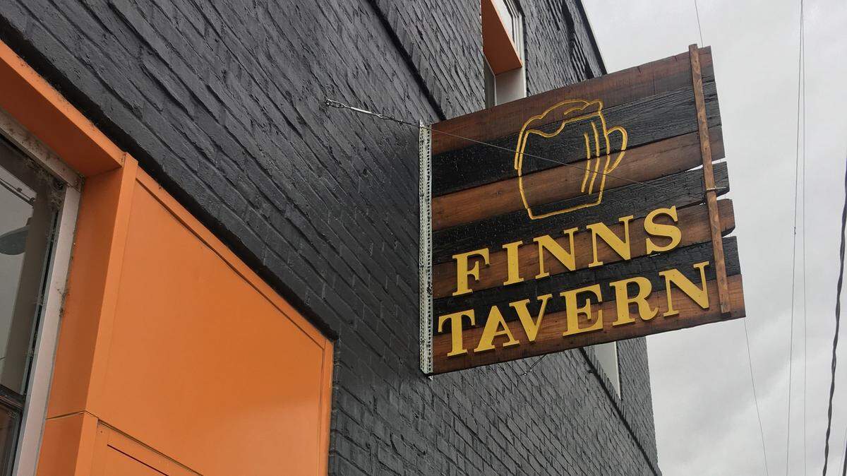 There’s a sign for Finns Tavern along Commerce Street, but there are no drinks or even a business there.
