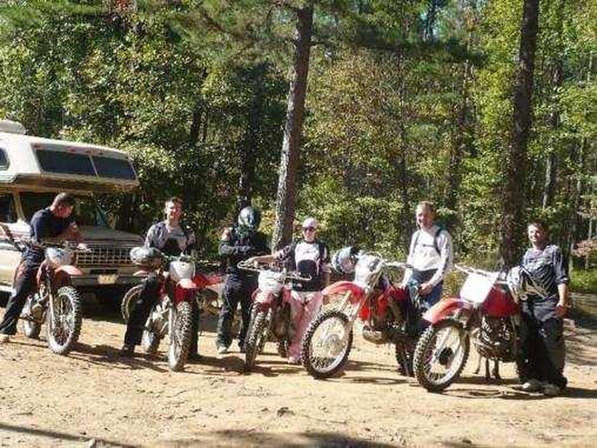Some members of a dirt bike gang pose for a photo. Thomas Doyle (right) died in a hit and run wreck on Aug. 18 in Wichita.