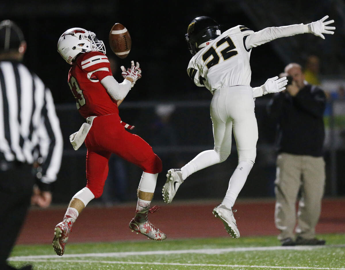 Maize wide receiver #13 Jordon Helm can’t quite pull in a pass from Caleb Grill as Maize South #22 Ryan Hays defends on the play.  (November 2, 2018)