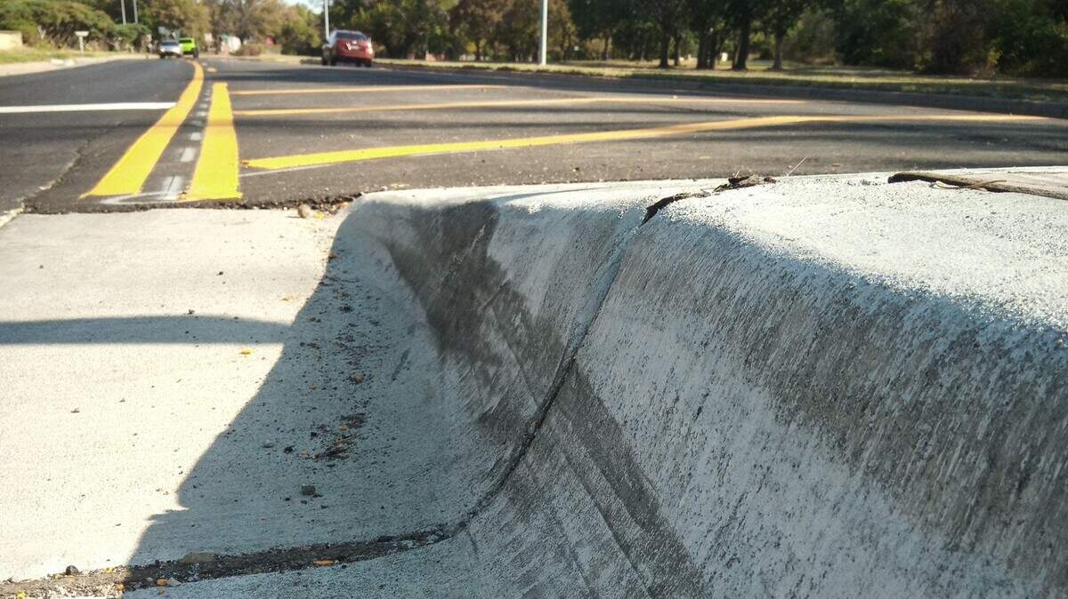 Scuff marks like these show where drivers have hit the concrete island the city recently installed in the center of McLean.