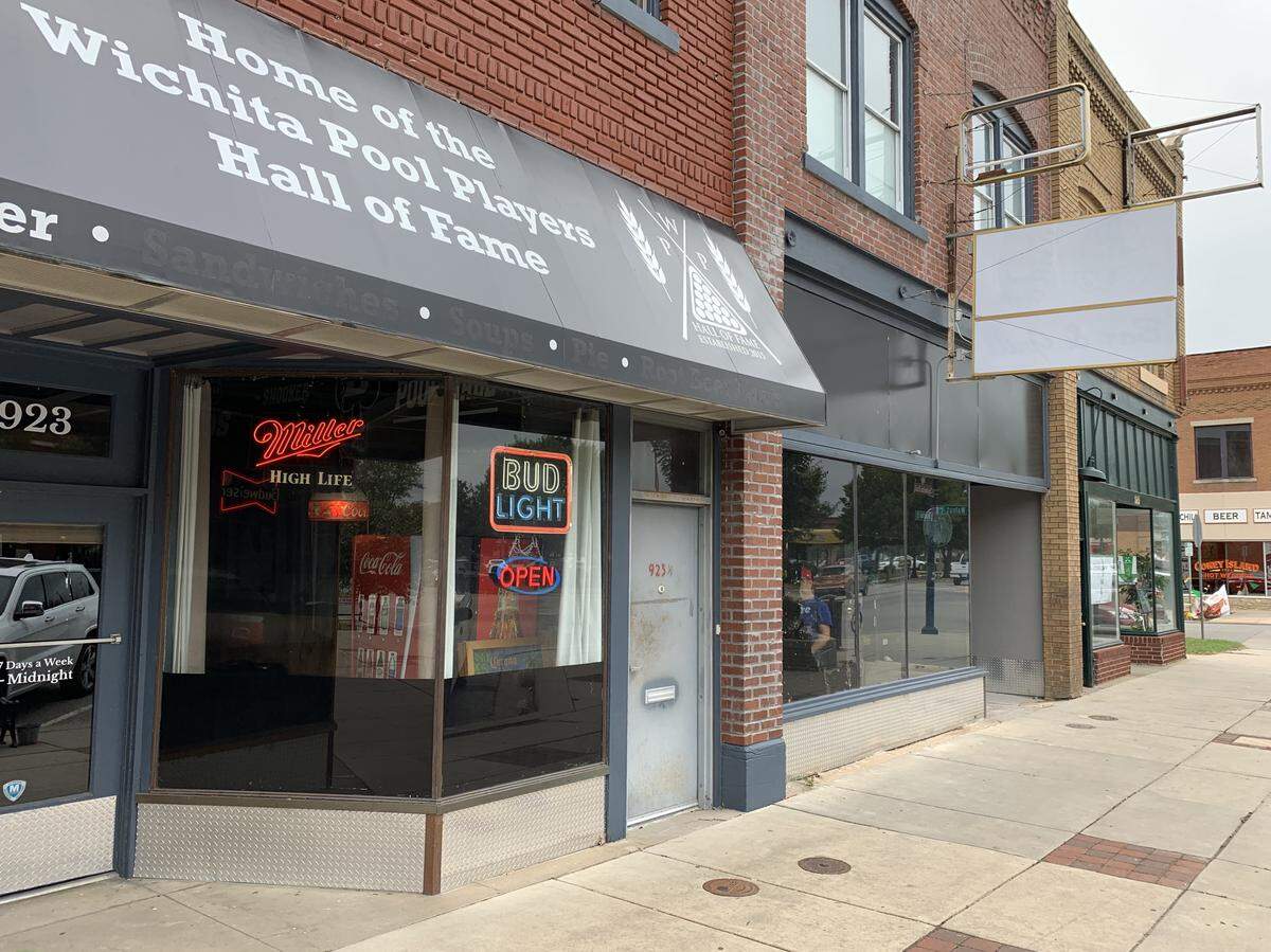 Club Billiards is still open but its operating in one side of the space it previously occupied on West Douglas.