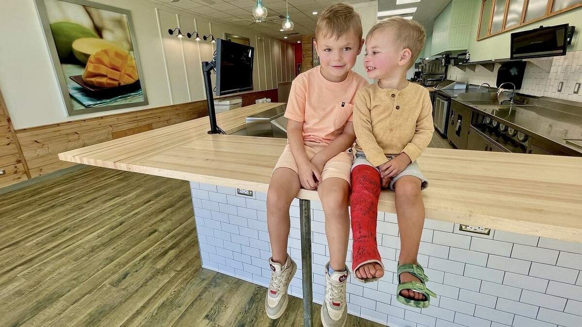 Aaron and Jenni Courtney will open their second Tropical Smoothie Cafe on Friday, this one at 21st and Webb on Wichita’s east side. They got help from their boys Judah, left, and Porter.