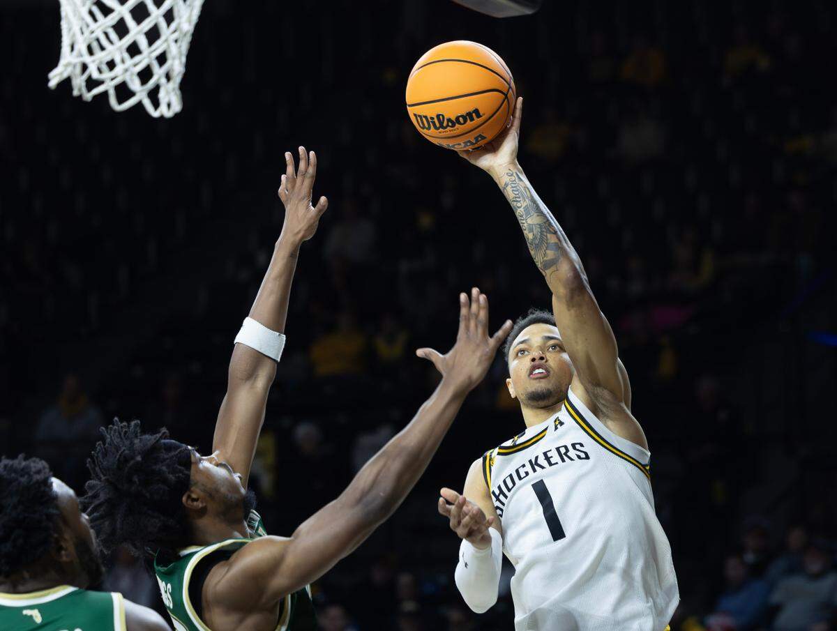 Wichita State’s Xavier Bell takes a shot against South Florida during the second half of their game on Monday night at Koch Arena. 