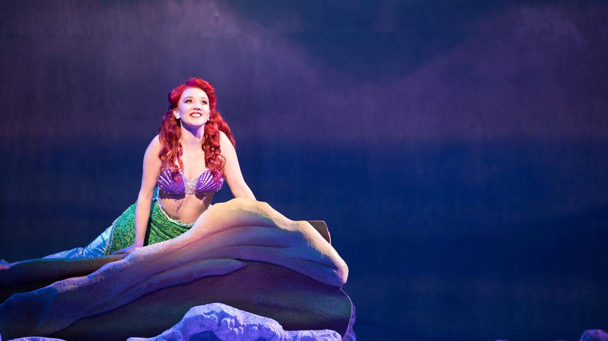 Ariel (Tatum Grace Ludlam) appears atop her famous rock in the Music Theatre Wichita production of Disney’s “The Little Mermaid,” playing August 8-18 at Century II.