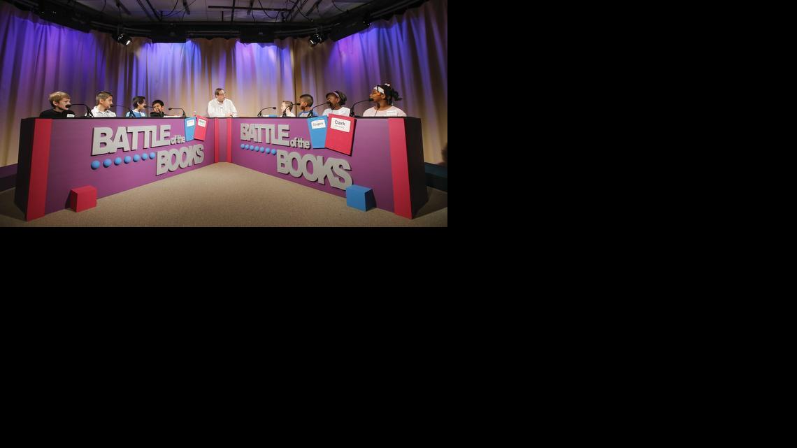 Host Jim Kobbe asks questions to students from Clark Elementary and Beech Elementary during a live Internet broadcasts of the Battle of the Books competition. The contest, taped in a studio at the USD 259 School Service Center, tests the knowledge kids have about books they’ve been assigned to read.

