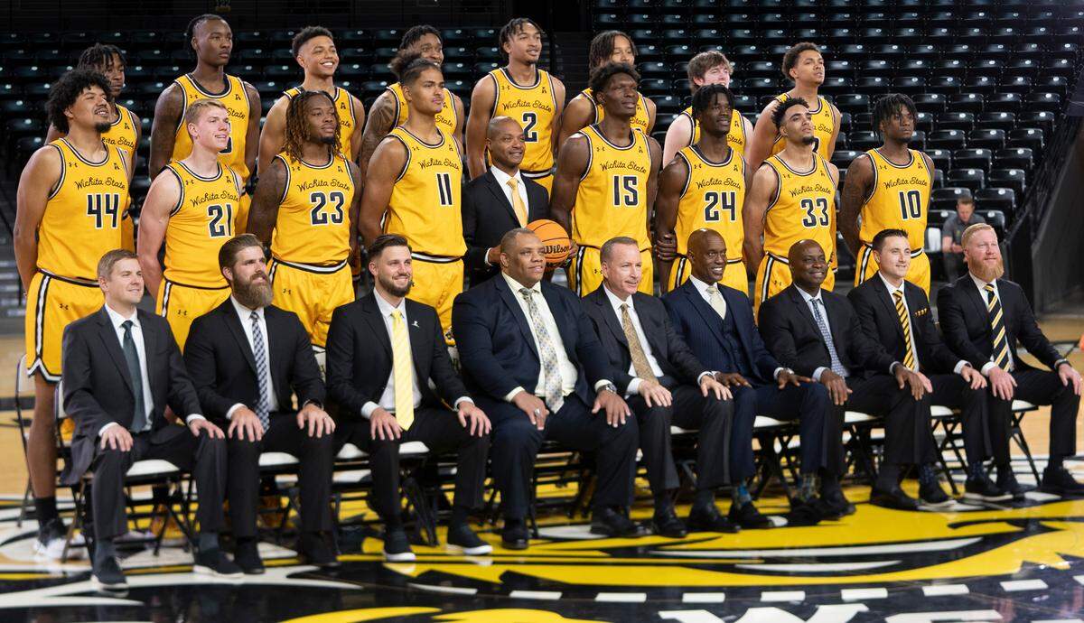 The Wichita State Men’s Basketball team has their photo taken during media day. At center is head coach Isaac Brown.