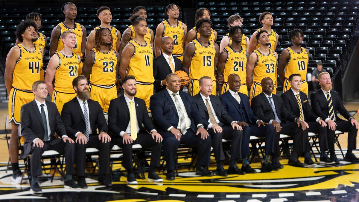 The Wichita State Men’s Basketball team has their photo taken during media day. At center is head coach Isaac Brown.