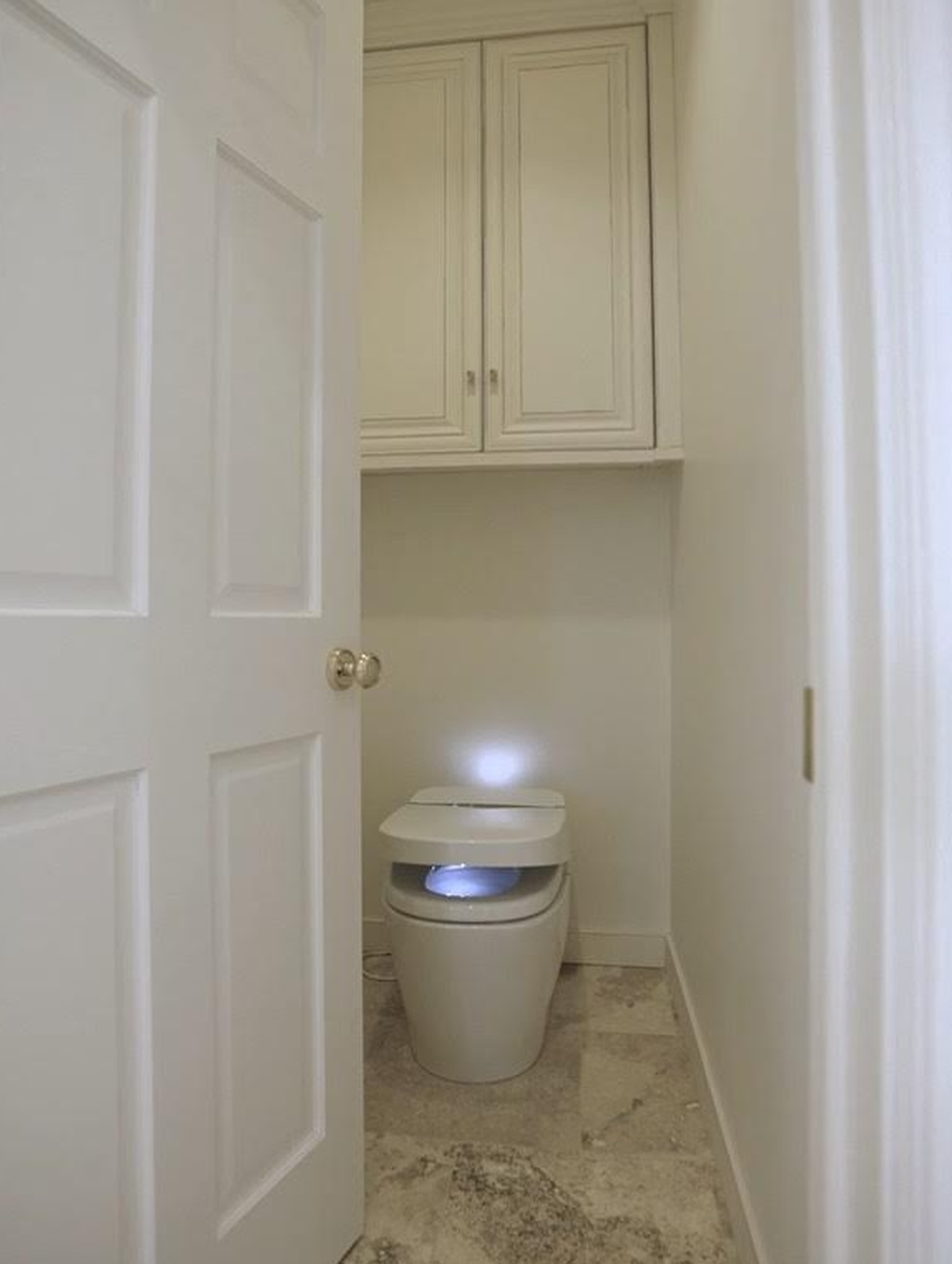 This toilet in the master bathroom of 1440 N Gatewood St. is worth around $5,800, and is complete with bidet mode, a nightlight, heated seat and a remote control.