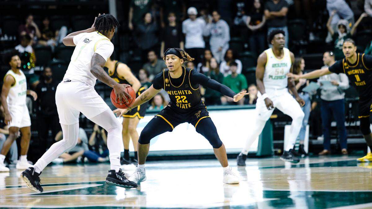 Wichita State’s Shammah Scott defends a South Florida player in the first half of the Shockers’ game in Tampa on Sunday afternoon.