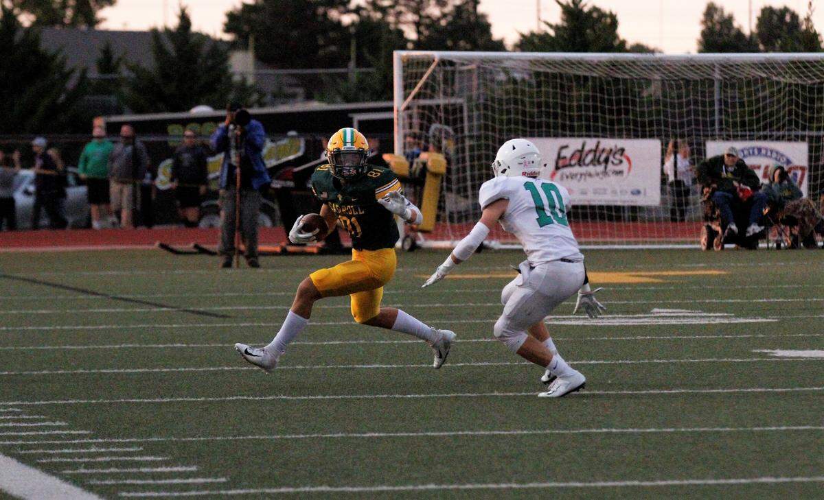 Bishop Carroll senior receiver Mason Baalman turns upfield against Derby in the Golden Eagles’ 26-4 loss on Friday. (Sept. 21, 2018)
