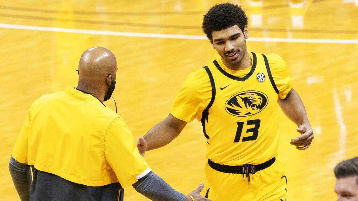 Missouri’s Mark Smith, right, is greeted by head coach Cuonzo Martin as he comes off the court during the first half of an NCAA college basketball game against Alabama Saturday, Feb. 6, 2021, in Columbia, Mo. (AP Photo/L.G. Patterson)