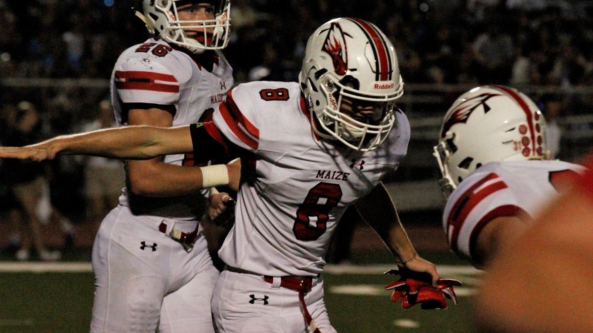 Maize junior defensive back Camden Jurgensen celebrates with a teammate after his 95-yard kickoff return for a touchdown in the Eagles’ 21-0 shutout of Campus on Friday night. (Sept. 14, 2018)