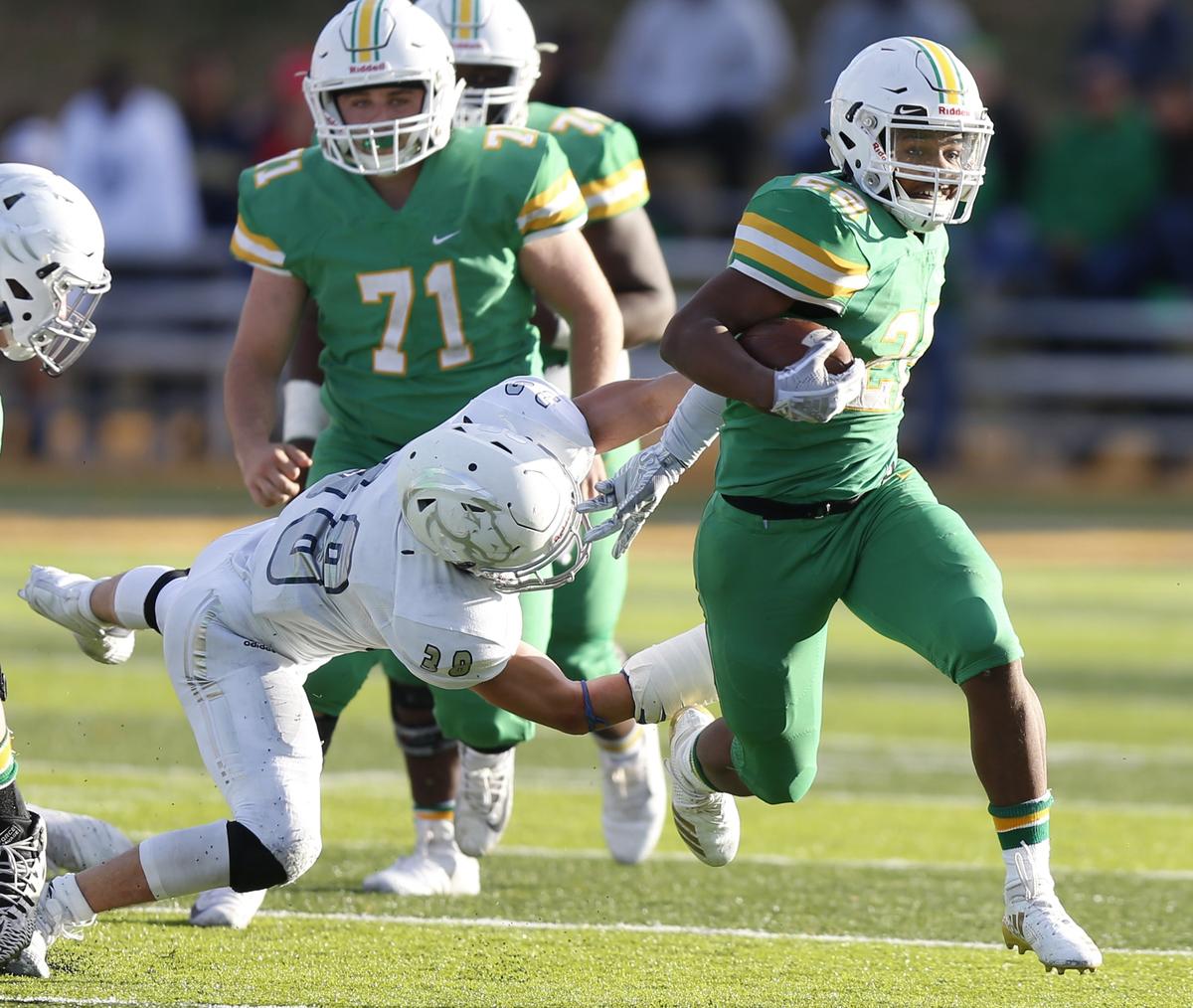 Derby running back #22 Tre Washington breaks loose for a 69 yard touchdown run against Blue Valley North Saturday afternoon in 6A State Championship.  (November 24, 2018)