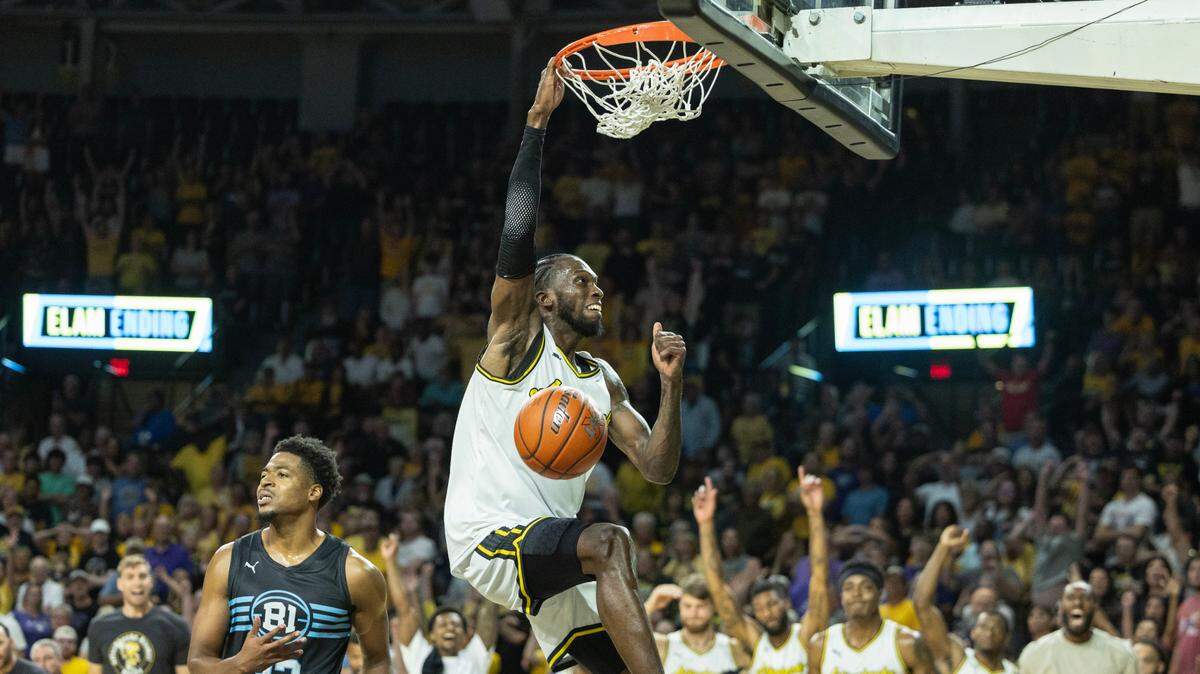 Jordan Parks of the Aftershocks slams home the final points in their 66-54 win over the B1 Ballers on Thursday night during the The Basketball Tournament at Koch Arena. 