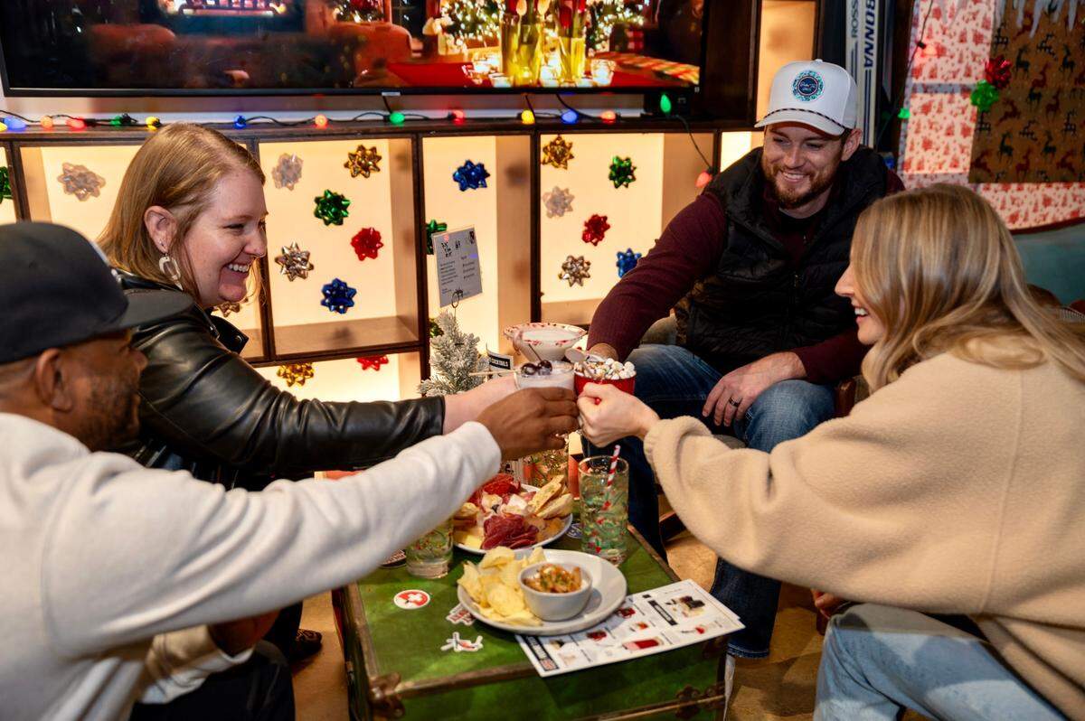 Chicken N Pickle’s holiday pop-up bar is titled “Holiday Hideaway.”