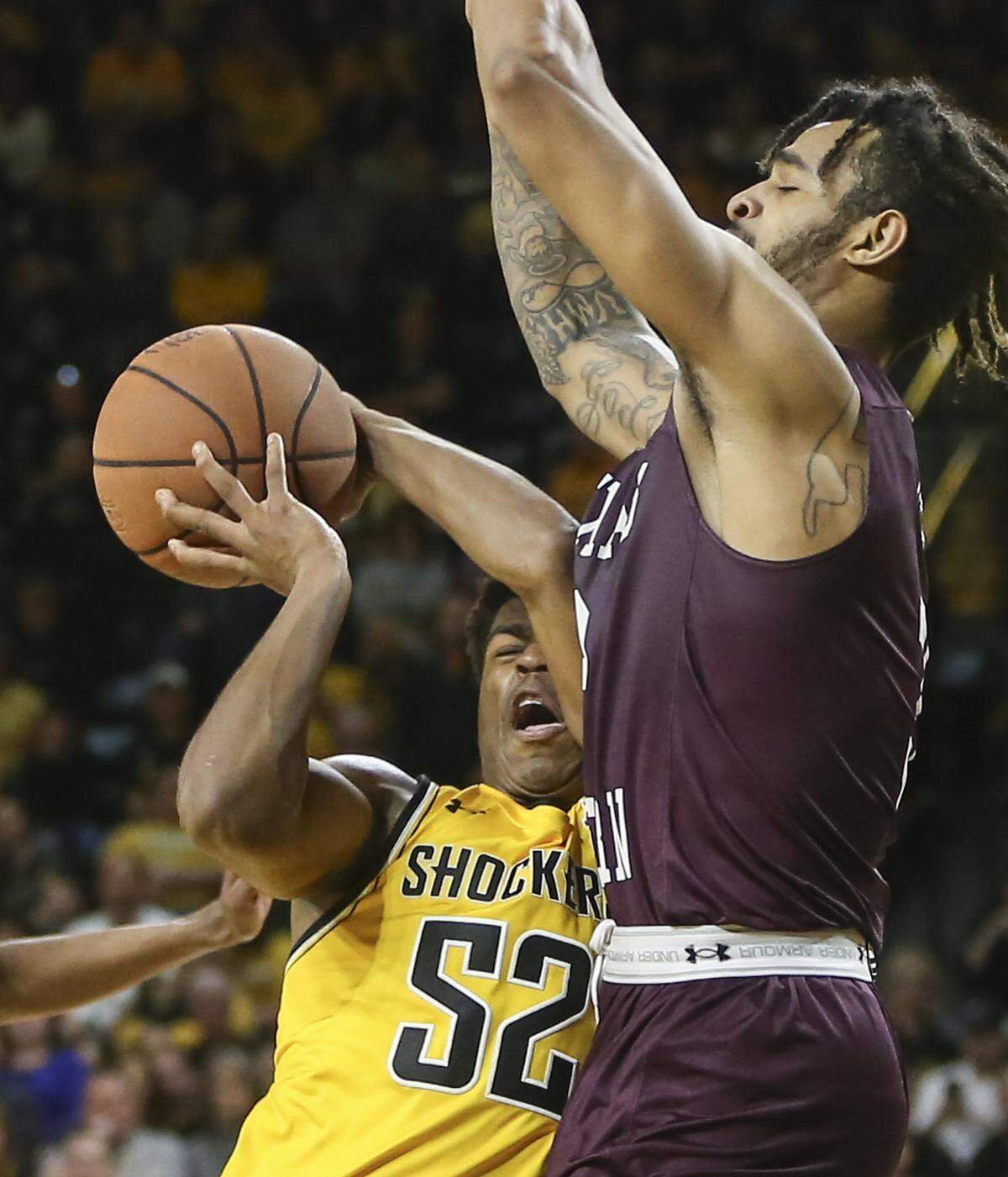 Wichita State’s Grant Sherfield is fouled by Texas Southern’s Justin Hopkins during the second half of their 69-63 win at Koch Arena on Saturday.