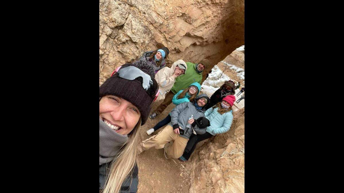 Melissa Steiner takes a selfie of their group during a March 2021 trip to the Grand Canyon. In the photo, Thomas Doyle leans back as his daughter, Marlie, puts her hand on his shoulder.