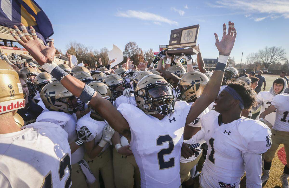 St. Thomas Aquinas’ Jayden Russell celebrates winning the 5A state title over Wichita Northwest on Saturday in Pittsburg. 