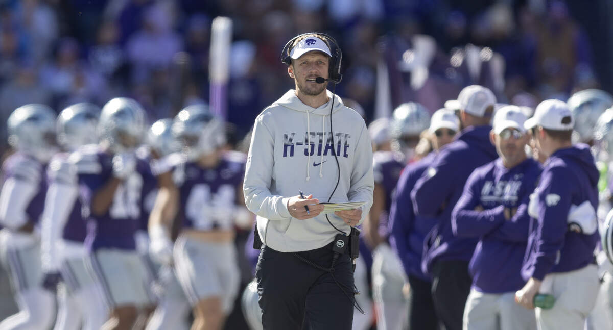 Kansas State head coach Collin Klein paces the sideline during the first half of their game against Kansas in Manhattan on Saturday.