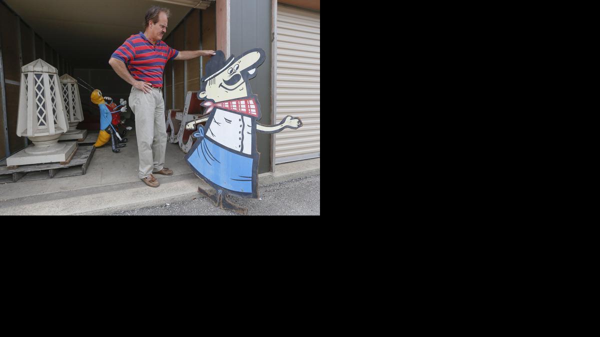 Greg Kite who heads the Wichita-Sedgwick County Historic Preservation Alliance, stands next to an original Pizza Hut Pete sign from an early Pizza Hut location in Wichita.

