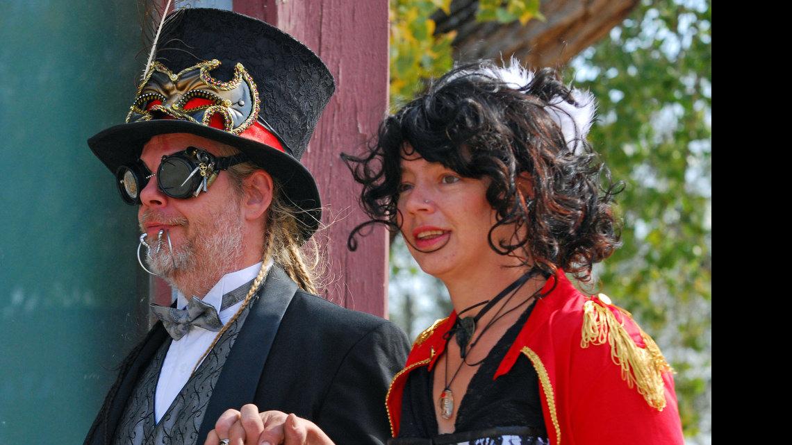 Performers Shon and Heather Gunderson walk the boardwalk at Old Cowtown Museum during Steampunk Day. (Nov. 5, 2011)