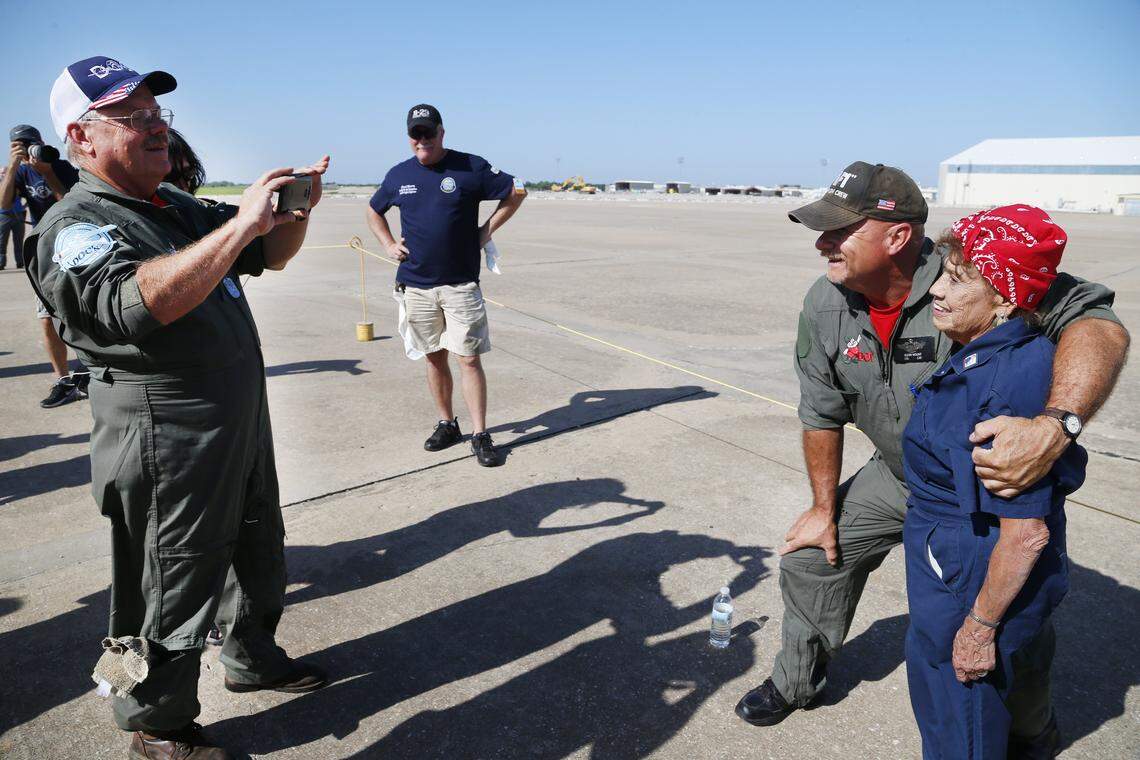 In 2016, Connie Palacioz posed with members of the Doc flight crew. Palacioz installed rivets on Doc during World War II and helped rebuild the plane by volunteering in 2013.
