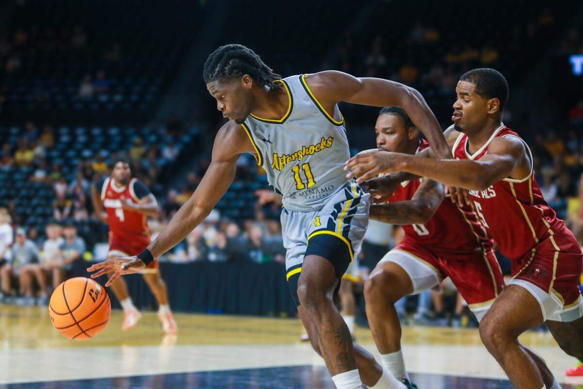 Small Forward Chevez Goodwin dribbles the ball down the court during the AfterShock’s game on Sunday night.