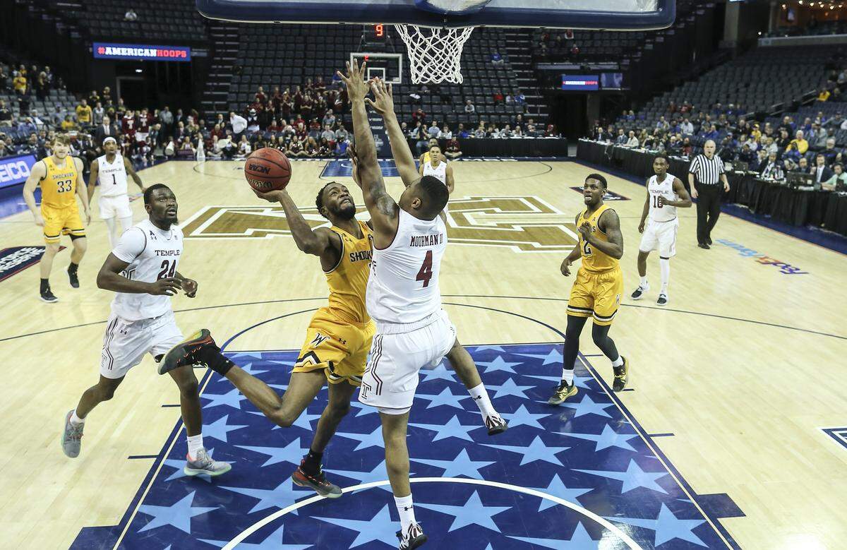 Wichita State forward Markis McDuffie goes to the basket against Temple forward J.P. Moorman II during the second half of their American Athletic Conference quarterfinal game in Memphis on Friday.
