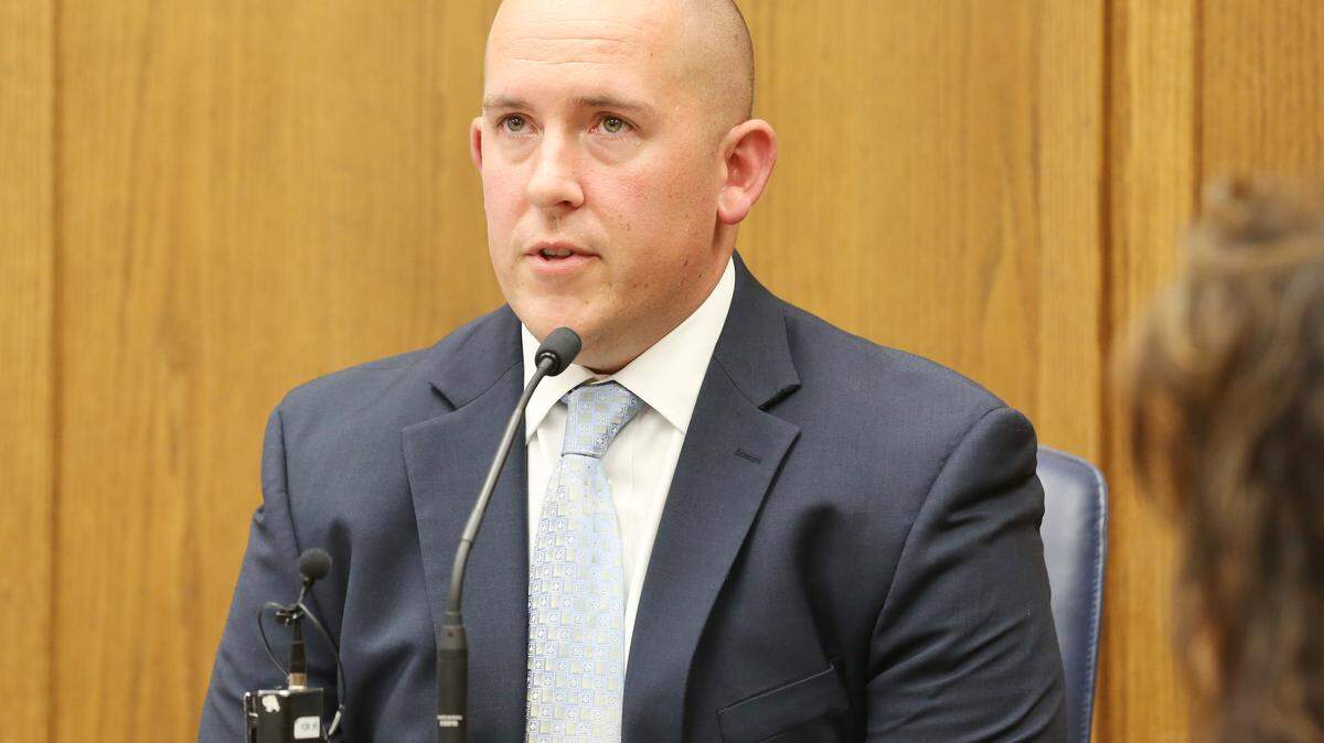 Justin Rapp, shown here answering questions at a 2018 hearing on the swatting death of Andrew Finch, has been recently promoted from officer to detective by the Wichita Police Department.