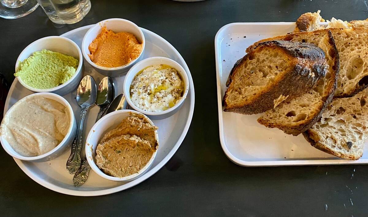 FioRito offers a pre-meal bread service featuring house-made sourdough and choice of spreads.