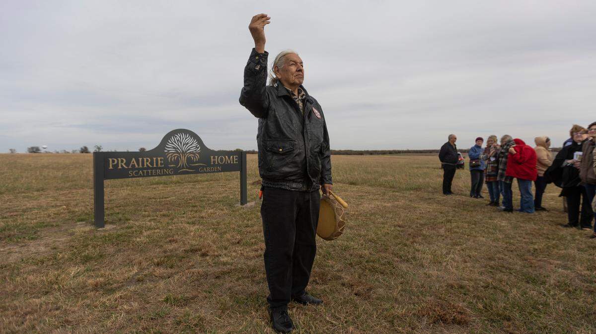 Mark Brown from the Wichita Indian United Methodist Church spreads ceremonial tobacco during a ceremony opening the Prairie Home Scattering Garden on south 79th street recently. The new cemetery is designed for people to bury or spread the ashes of their loved ones who have been cremated.