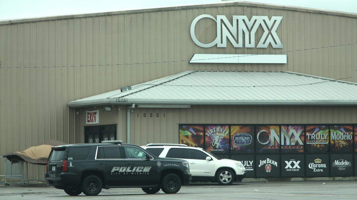 A Wichita Police Department cruiser sits outside of the Onyx Event Center in east Wichita after a shooting early Sunday in the club’s parking left one man dead and two others injured.