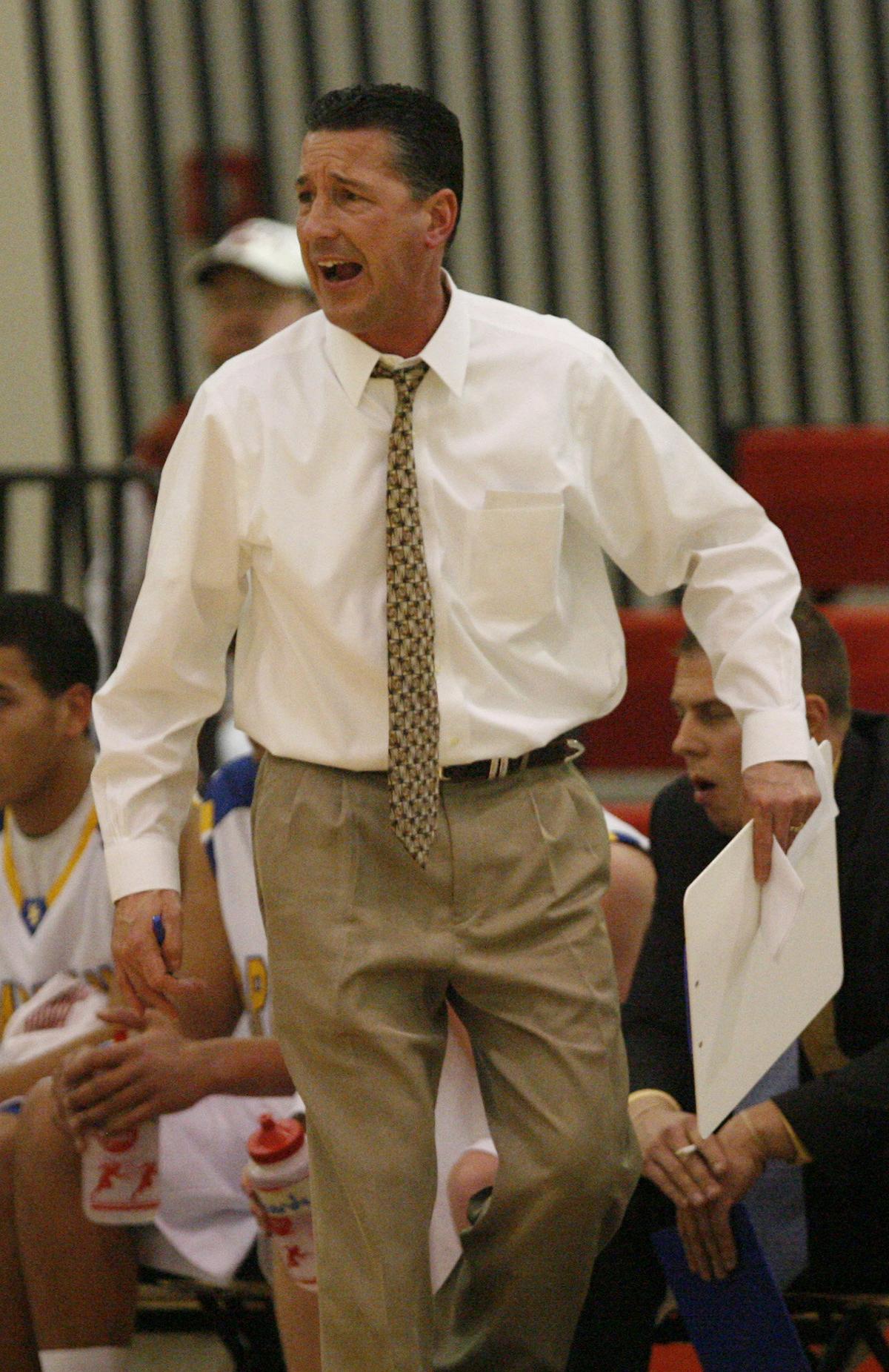 Collegiate head coach Mitch Fiegel tries to get his team back into the game in the first half during the Bluestem Classic in El Dorado. Collegiate trailed Great Bend for the entire first half. (Jan. 23, 2010)